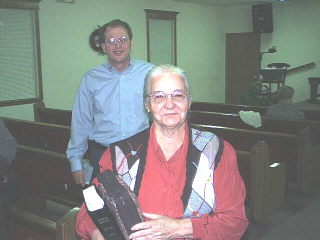 Sis. Perez  getting ready to leave church after Wed. Night Bible Study, Bro. Johnson in the background.